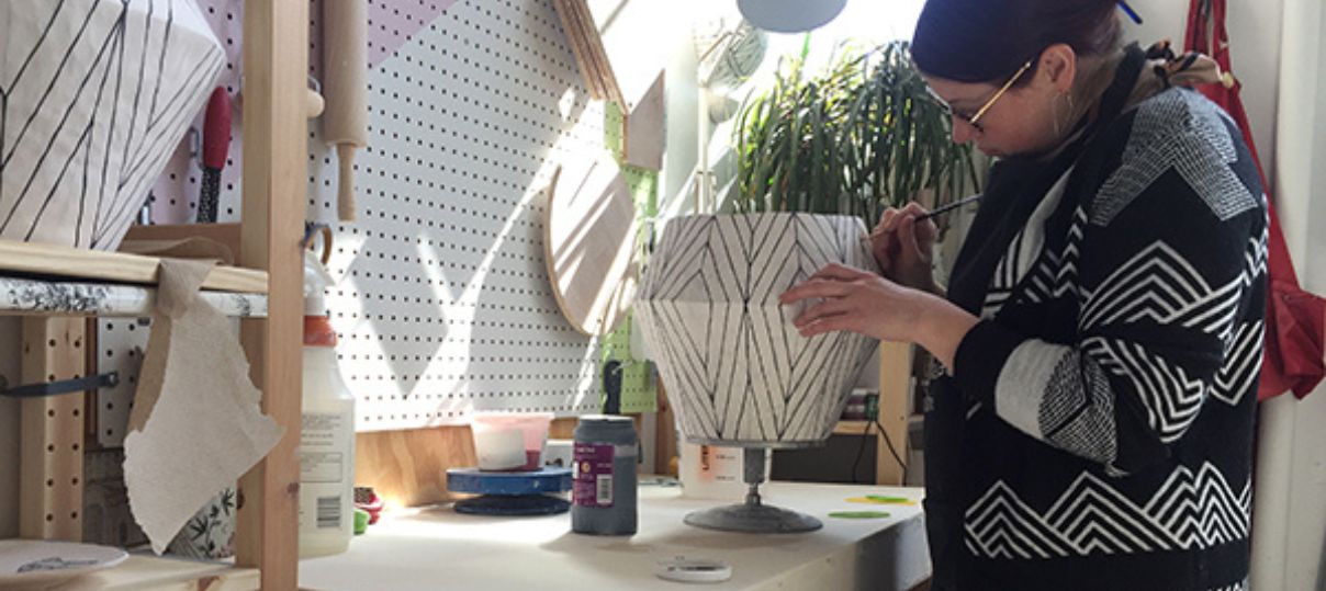 Artist working inside ceramics studio