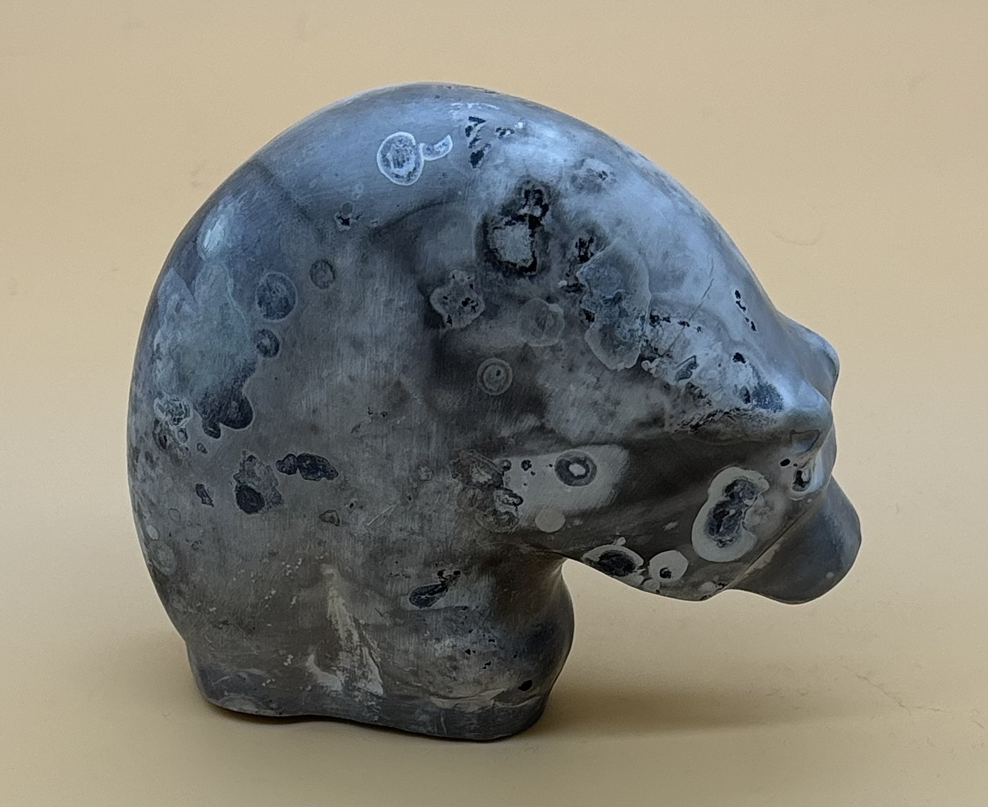 Black and gray globular ceramic form.